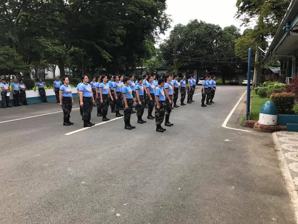 PNP personnel wearing the light blue SAR shirt with the PULIS marking during a unit formation.