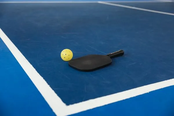 Pickleball paddle and ball close-up