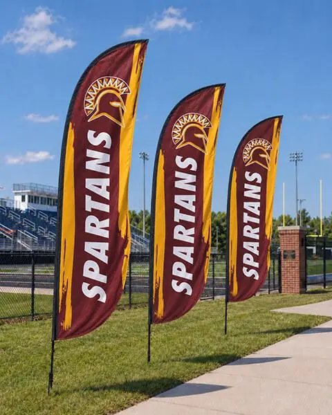Custom feather flags installed on a sports field