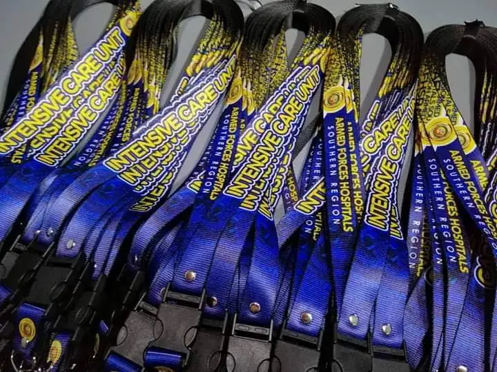 Stack of blue polyester lanyards printed with Intensive Care Unit Armed Forces Hospital Southern Region logo, with safety breakaway clasps
