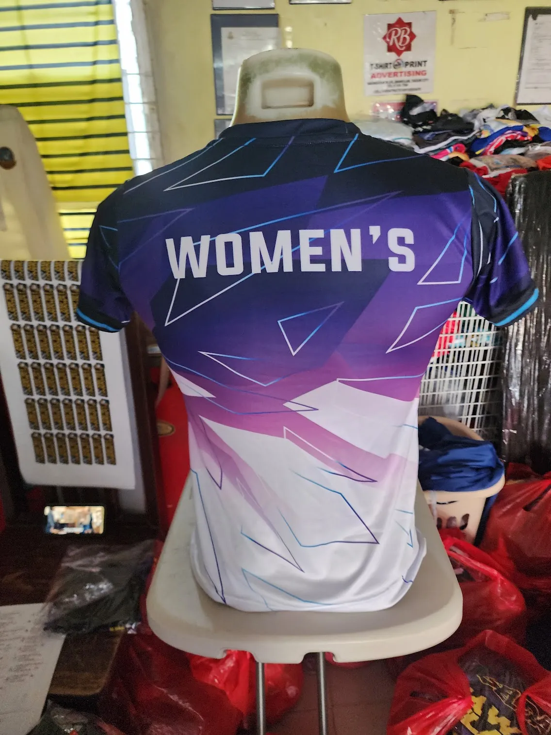 Custom sublimation women's performance running tee on mannequin