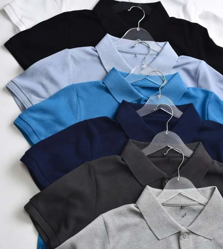 Corporate polo shirts in several colours on hangers